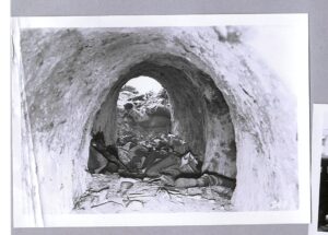 A Japanese tunnel captured by the 40th Division US Army in February 1945 with the body of a Japanese soldier.