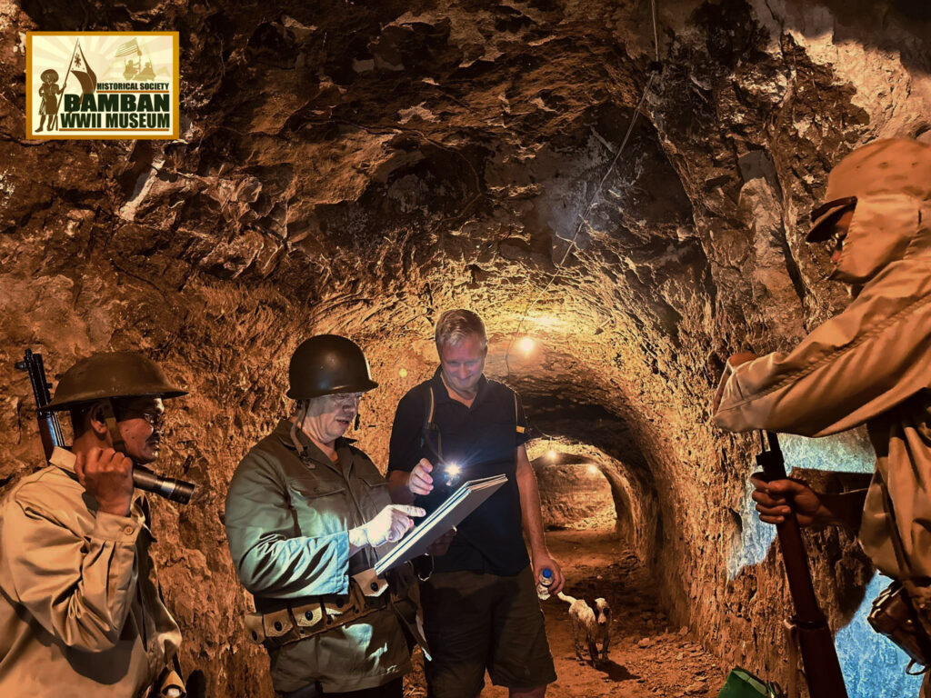 Rhonie Dela Cruz and volunteers of Bamban WWII Museum during WWII tours inside Japanese war tunnel.